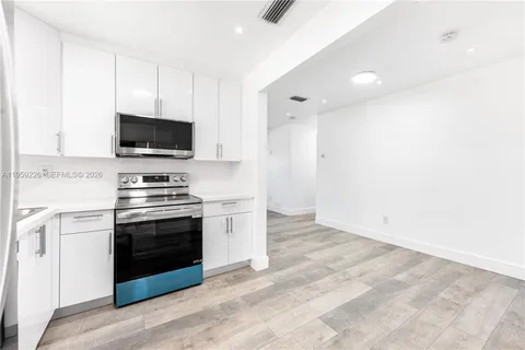 a view of storage and utility room with washer and dryer