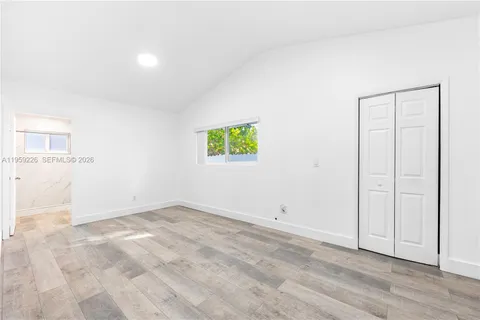 a bathroom with a double vanity sink mirror and shower