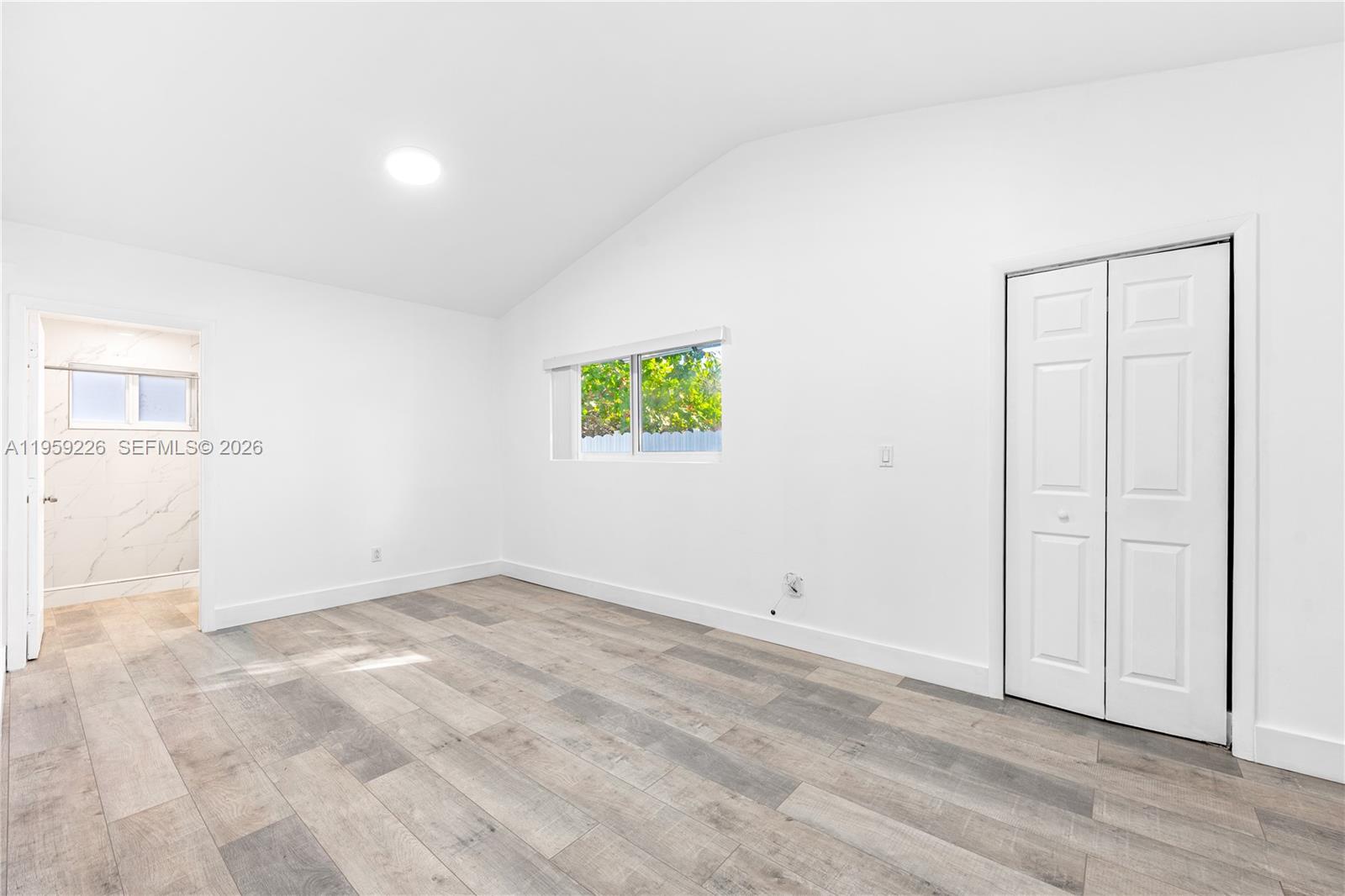 11970 Southwest 177th Terrace Miami, FL 33177 - Photo 18 of 47 an empty room with windows