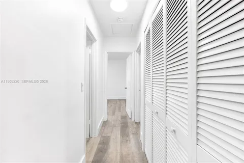 a view of room with wooden floor and window