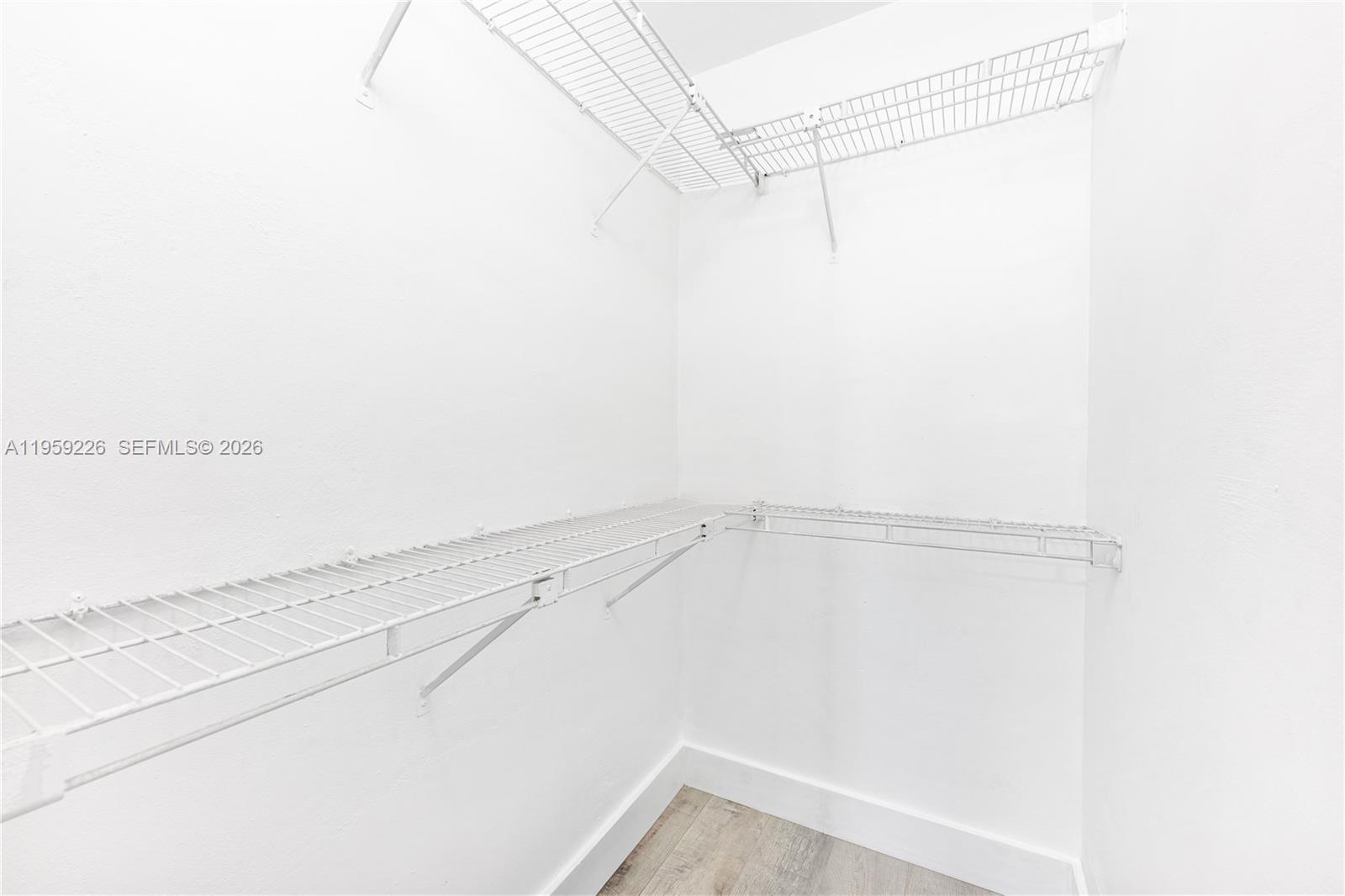 11970 Southwest 177th Terrace Miami, FL 33177 - Photo 27 of 47 a view of a room with racks on the wall