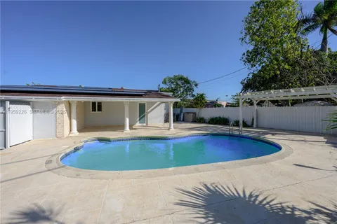 a view of a swimming pool with a patio