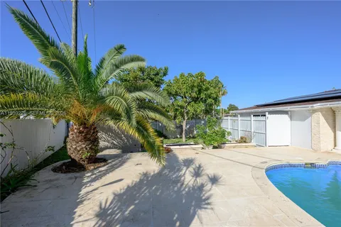 a view of a back yard of the house