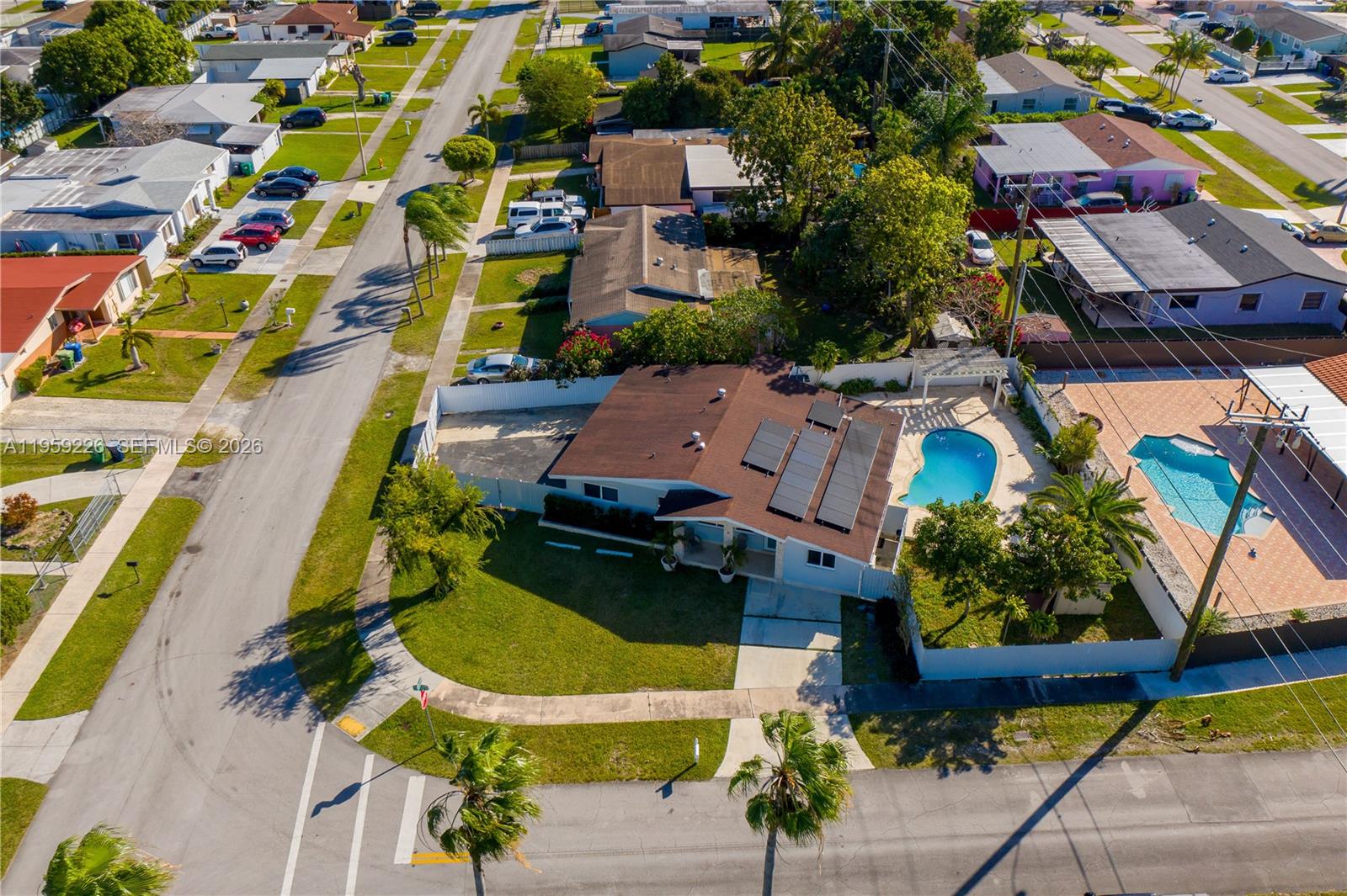 11970 Southwest 177th Terrace Miami, FL 33177 - Photo 42 of 47 an aerial view of residential houses with outdoor space and parking