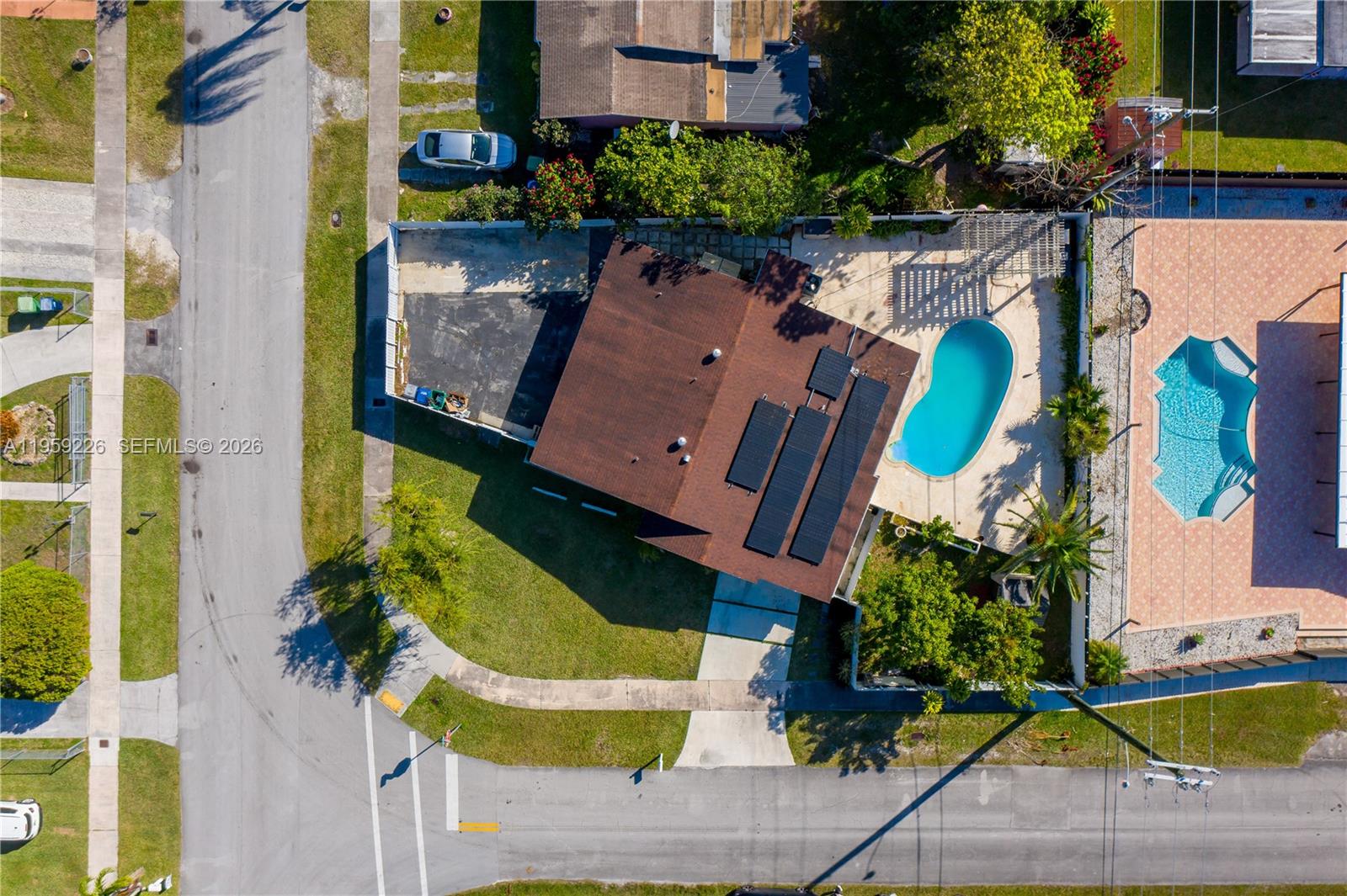 11970 Southwest 177th Terrace Miami, FL 33177 - Photo 43 of 47 an aerial view of a house with a swimming pool