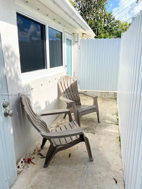 11970 Southwest 177th Terrace Miami, FL 33177 - Photo 44 of 47 a view of backyard with a table and chairs