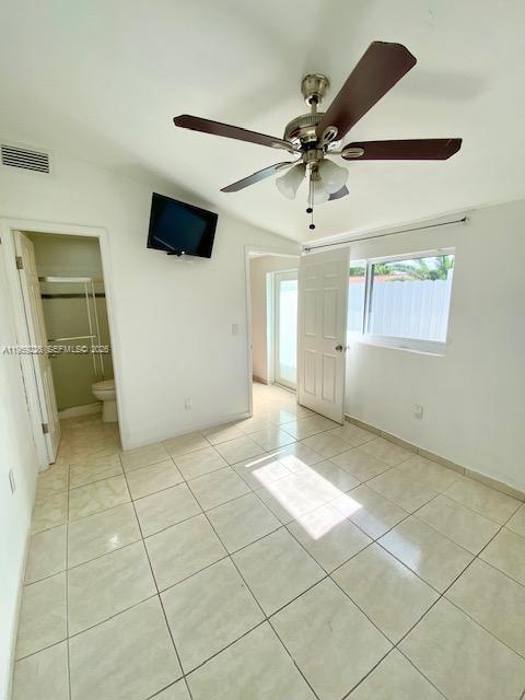 11970 Southwest 177th Terrace Miami, FL 33177 - Photo 45 of 47 a view of a livingroom with a chandelier fan and windows