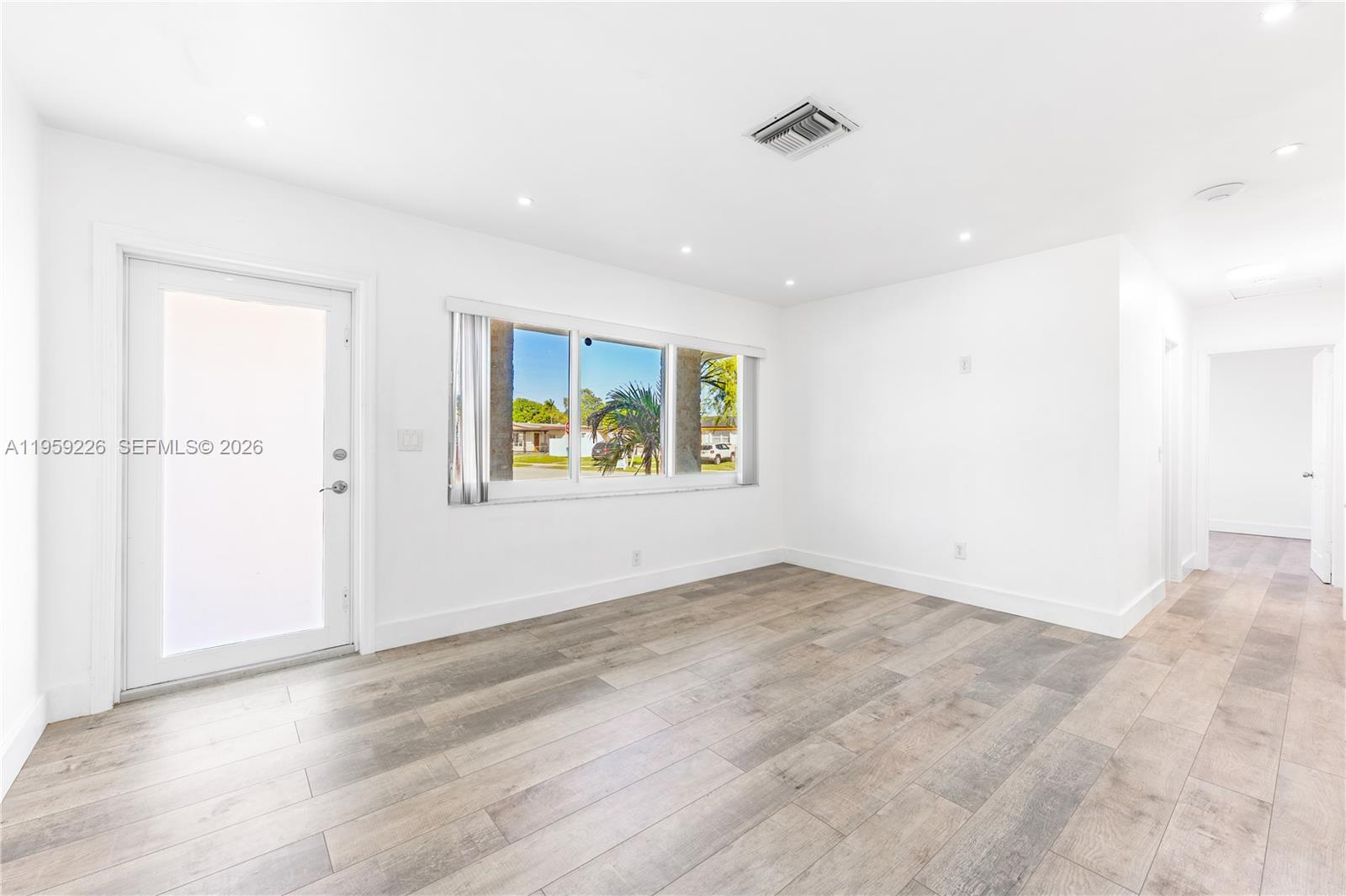 11970 Southwest 177th Terrace Miami, FL 33177 - Photo 6 of 47 an empty room with windows