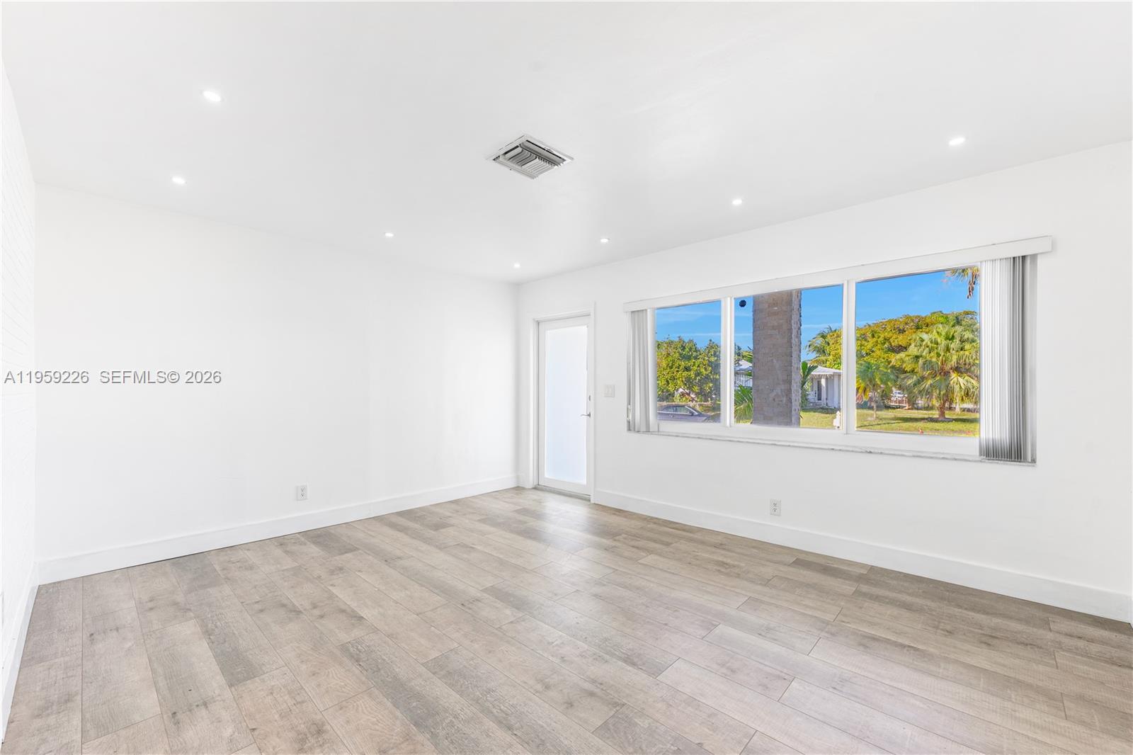 11970 Southwest 177th Terrace Miami, FL 33177 - Photo 7 of 47 an empty room with windows