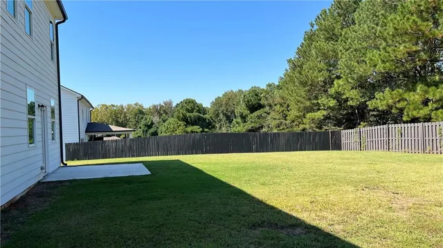 a view of swimming pool with a yard