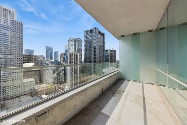 a view of a balcony with a floor to ceiling window
