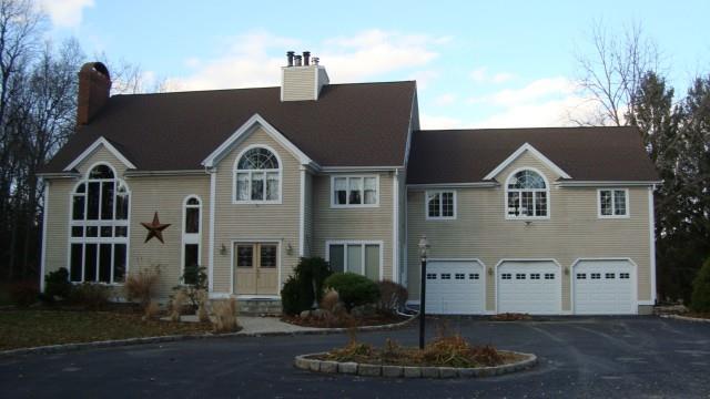 97 Josies Ring Road Monroe, CT 06468 - Photo 1 of 1 a front view of a house with a yard