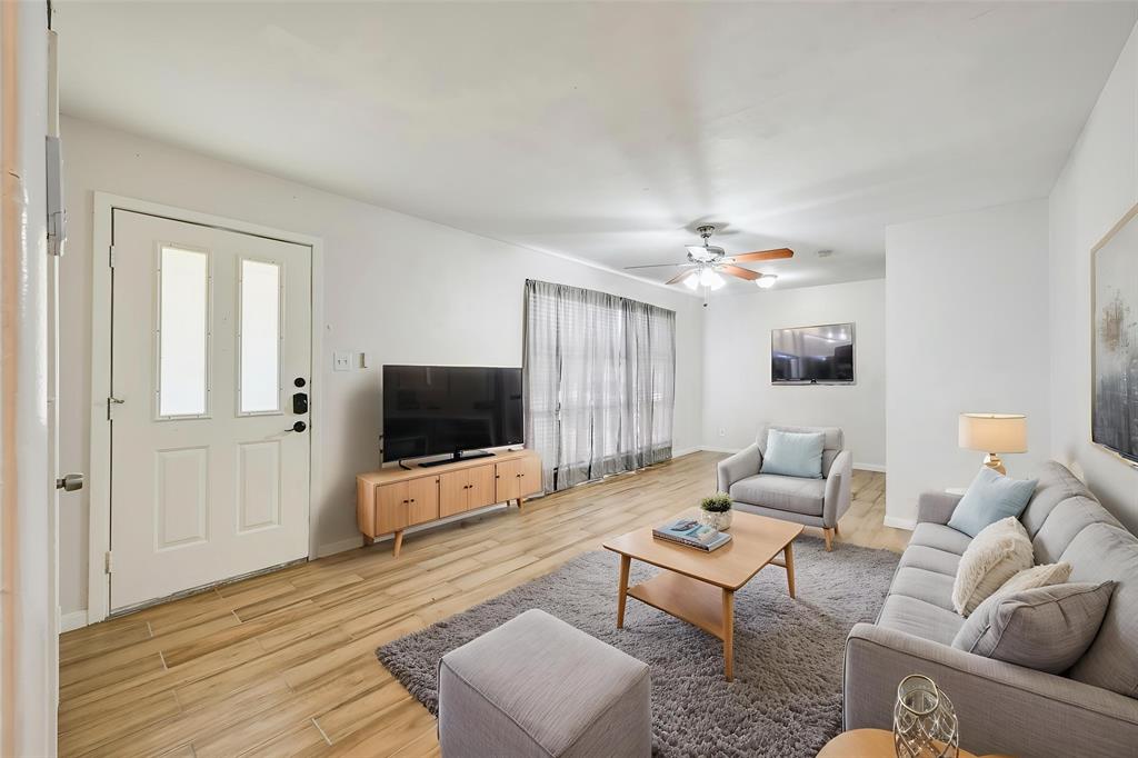 1905 South Cooper Street Arlington, TX 76010 - Photo 3 of 15 White painted interior walls with wood-finish flooring