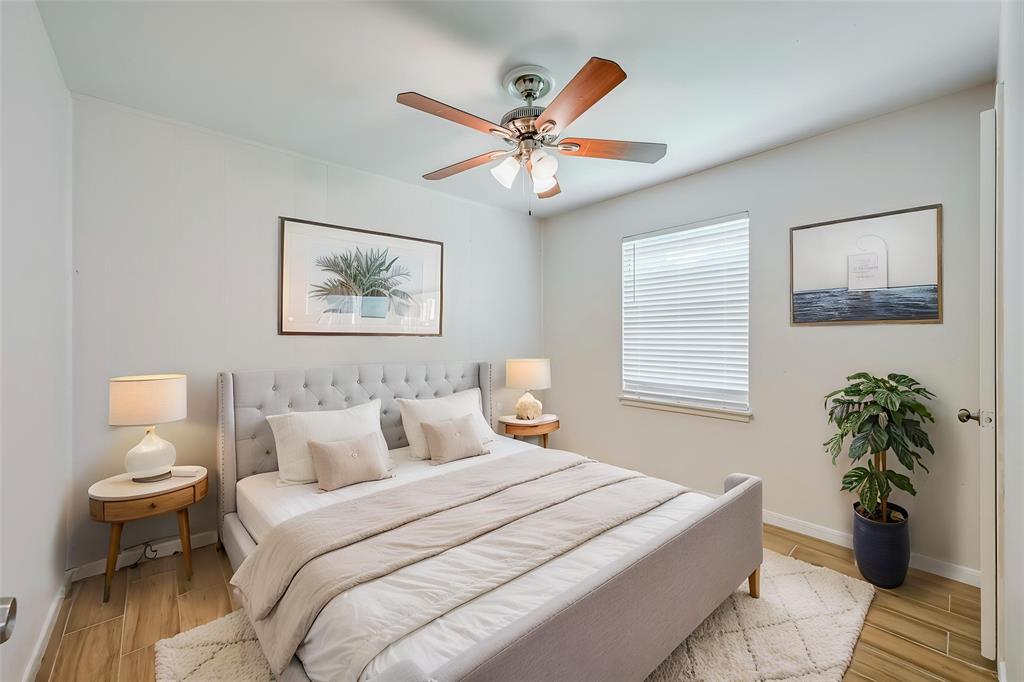 1905 South Cooper Street Arlington, TX 76010 - Photo 10 of 15 Neutral wall tones, wood-finish flooring, and a ceiling fan with light fixture