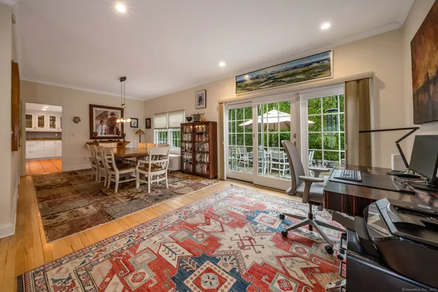 a large kitchen with stainless steel appliances granite countertop a lot of counter space and a sink