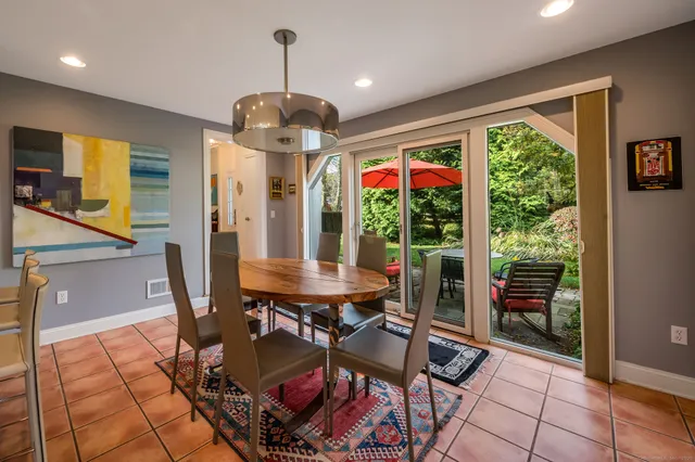 a bathroom with a sink mirror vanity and toilet