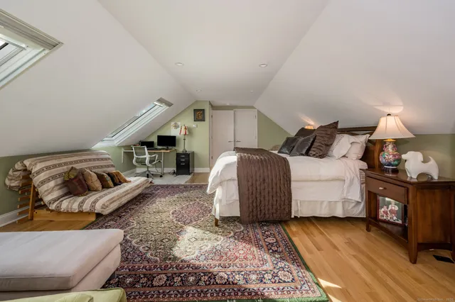 a bedroom with furniture and a window