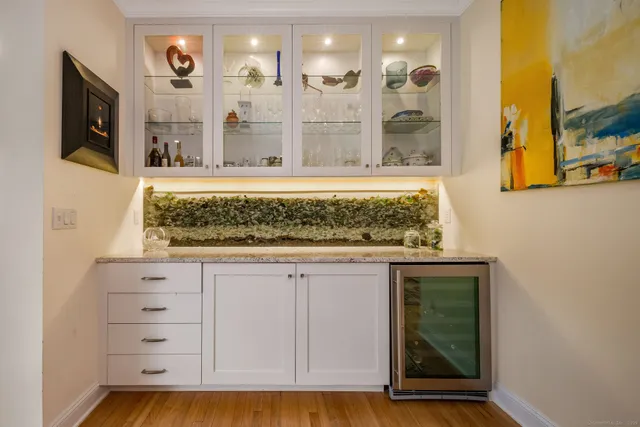 a living room with furniture and large windows