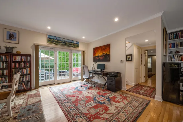 a large kitchen with stainless steel appliances kitchen island granite countertop a sink and cabinets