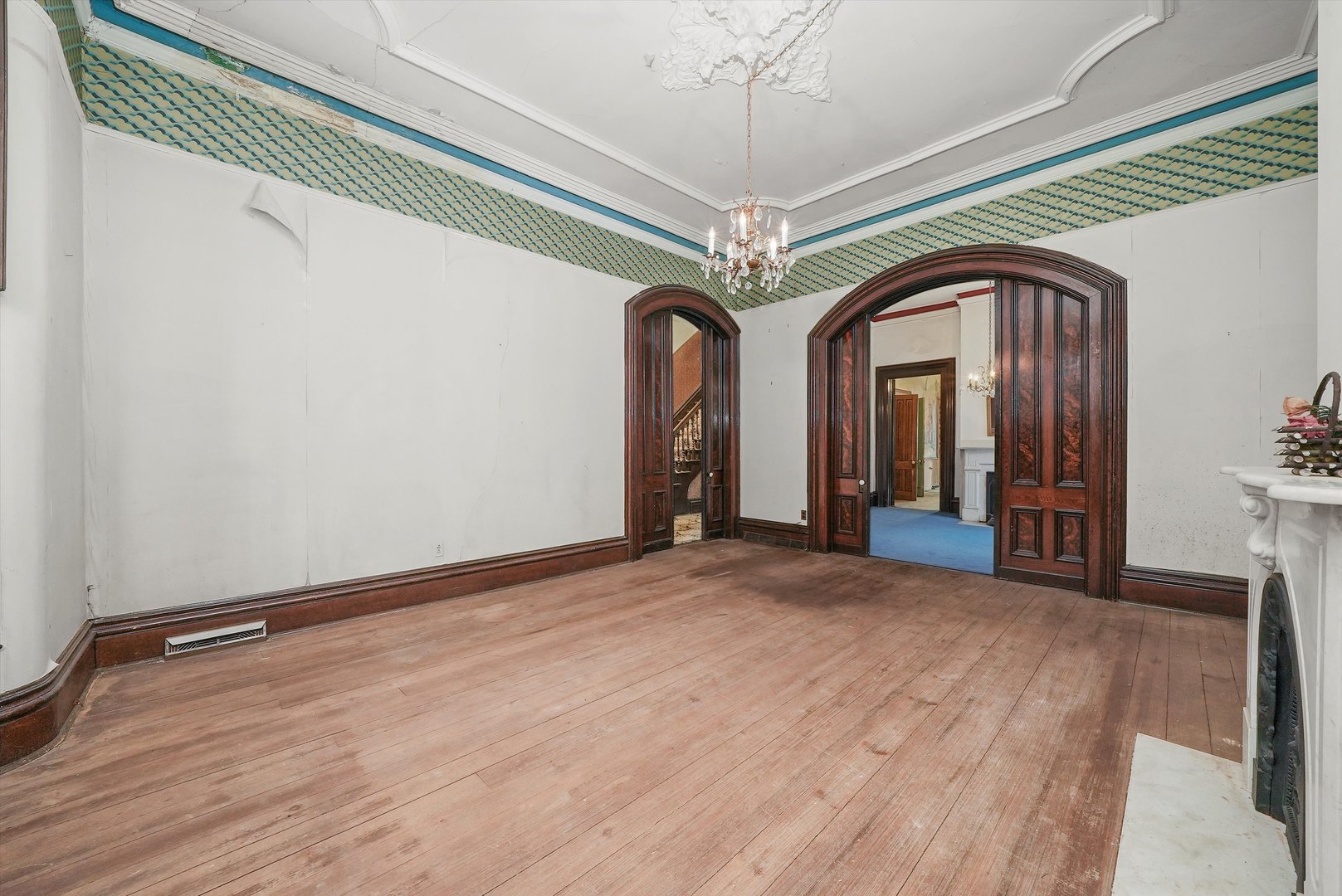 112 South Charleton Street Willow Springs, IL 60480 - Photo 14 of 34 a view of a hallway with wooden floor and a chandelier