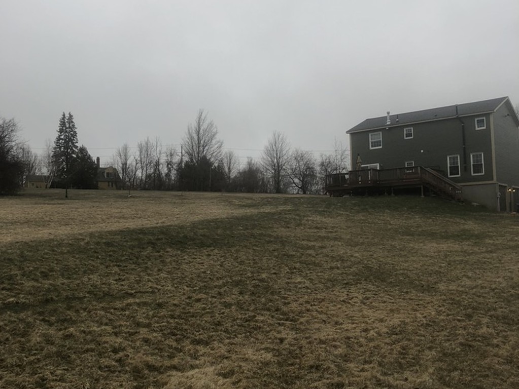 720 East Hill Road East Oakham, MA 01068 - Photo 23 of 25 a view of a field with trees in background