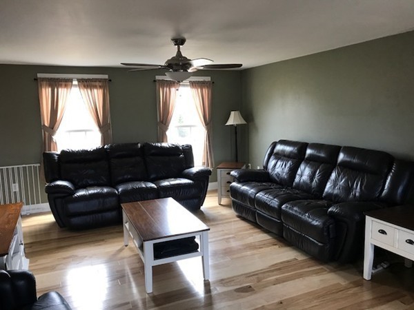 720 East Hill Road East Oakham, MA 01068 - Photo 4 of 25 a living room with furniture fireplace and a window
