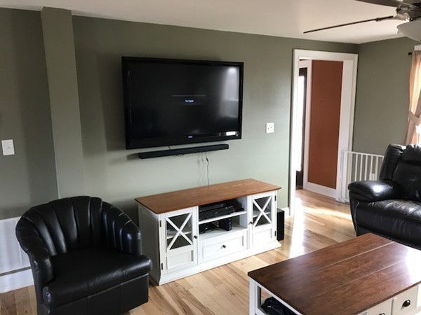 720 East Hill Road East Oakham, MA 01068 - Photo 6 of 25 a living room with furniture and a flat screen tv