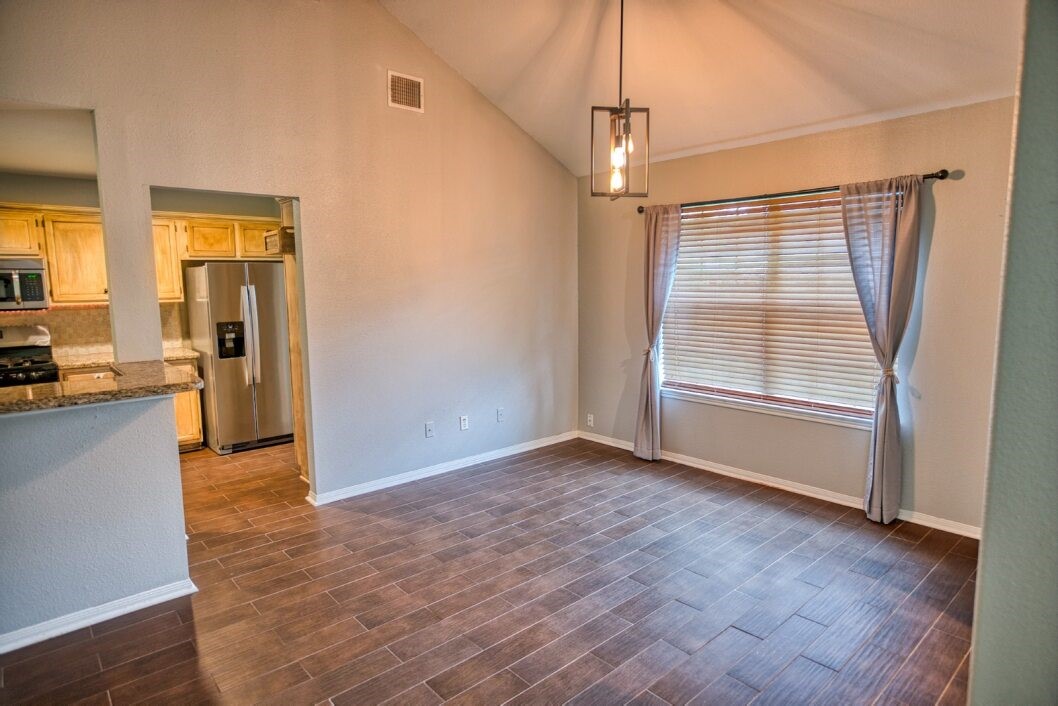 308 County Road 893B Angleton, TX 77515 - Photo 17 of 41 a view of empty room with wooden floor and fan