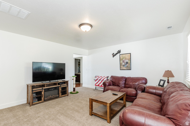 1145 West 2640th Street South Logan, UT 84321 - Photo 3 of 17 Spacious room featuring neutral carpet flooring and white painted walls