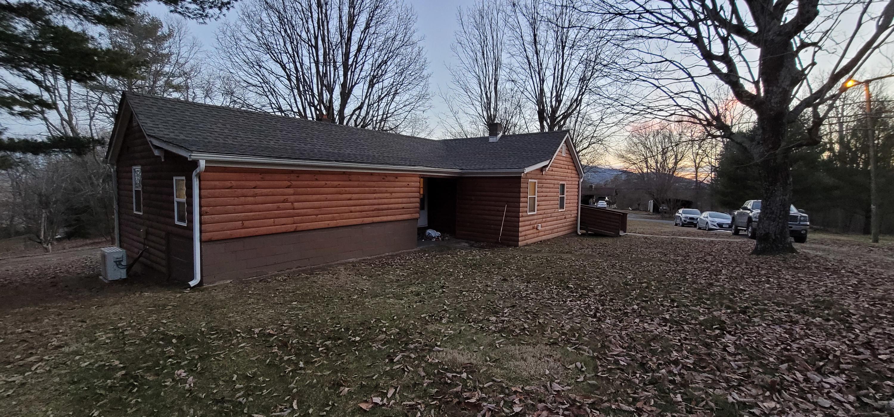 4241 Old Forge Road Rocky Mount, VA 24151 - Photo 14 of 16 a view of a backyard that has large trees and a large tree