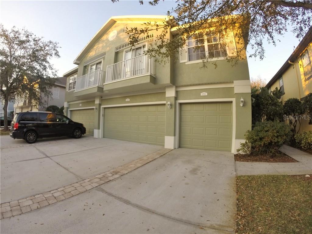 27551 Pleasure Ride Loop Wesley Chapel, FL 33544 - Photo 1 of 1 a view of a car parked in front of a house