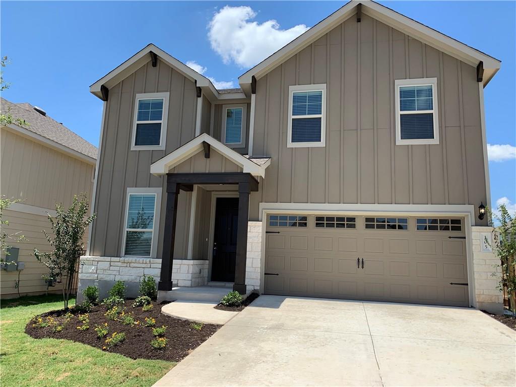 a front view of a house with yard