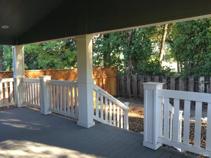 a view of balcony with wooden floor