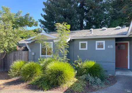 a view of a house with balcony and garden