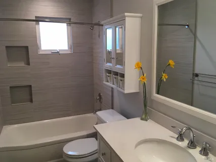 a bathroom with a sink toilet and shower