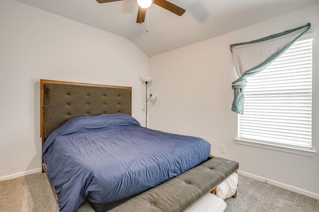 2313 Stallings Road Fort Worth, TX 76108 - Photo 21 of 30 a bedroom with a bed and window