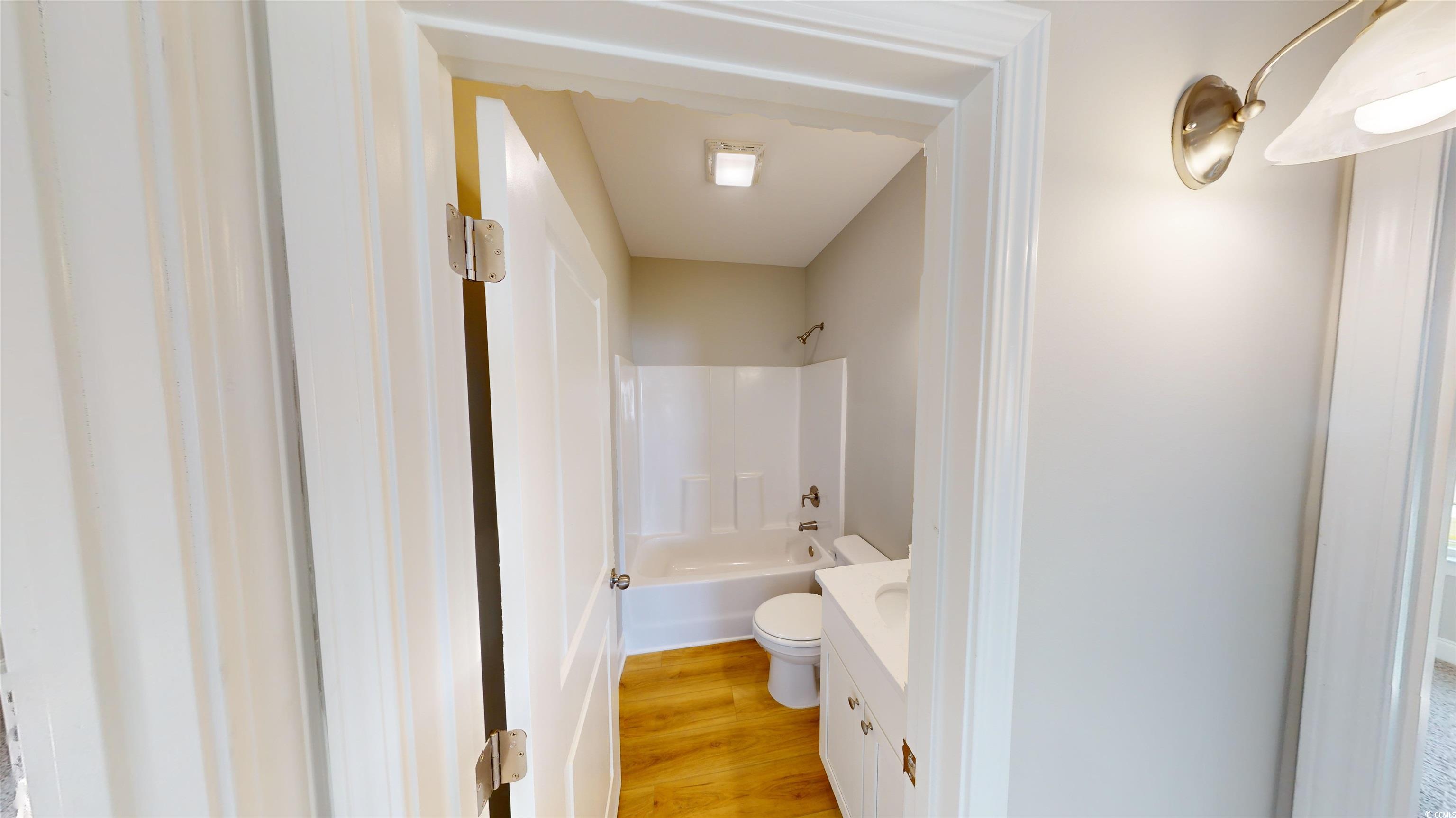 1044 Moen Loop, Unit LOT 12 Conway, SC 29526 - Photo 10 of 16 Bathroom featuring vanity, light wood finished floors, and shower / tub combination