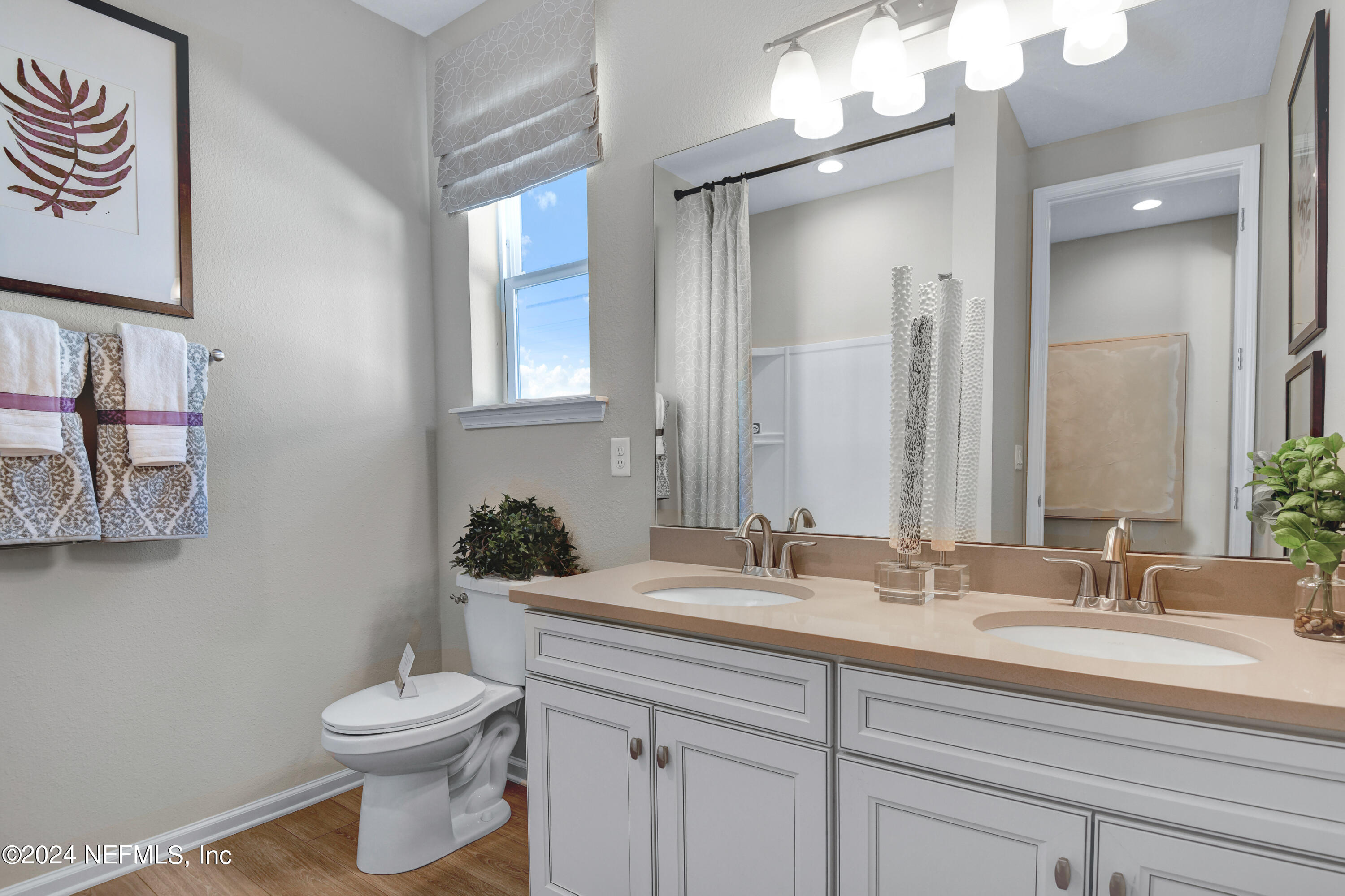 995 Cedar Slough Drive Jacksonville, FL 32220 - Photo 14 of 24 a bathroom with a toilet sink and mirror