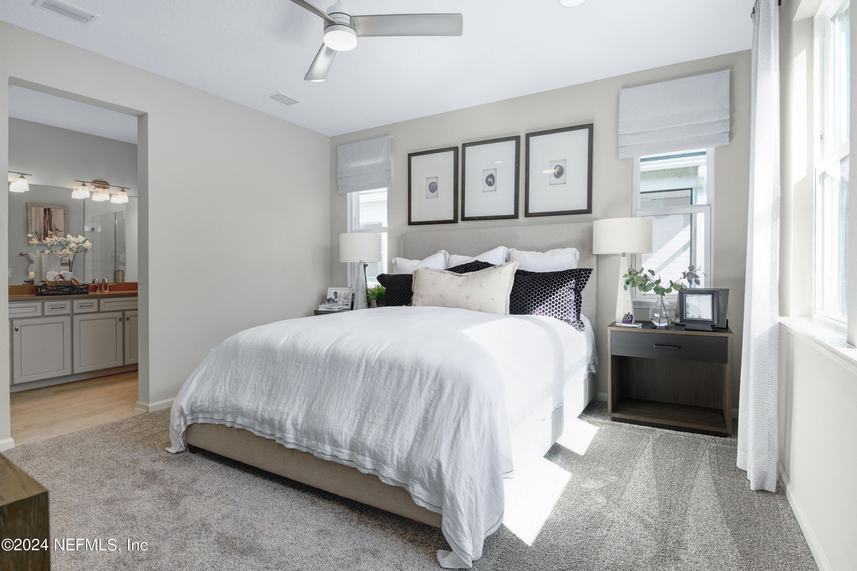 995 Cedar Slough Drive Jacksonville, FL 32220 - Photo 10 of 24 a bedroom with a bed and a painting