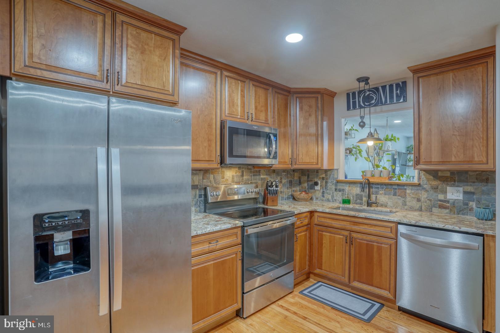 212 Mike Drive Elkton, MD 21921 - Photo 13 of 39 a kitchen with a sink stainless steel appliances and cabinets