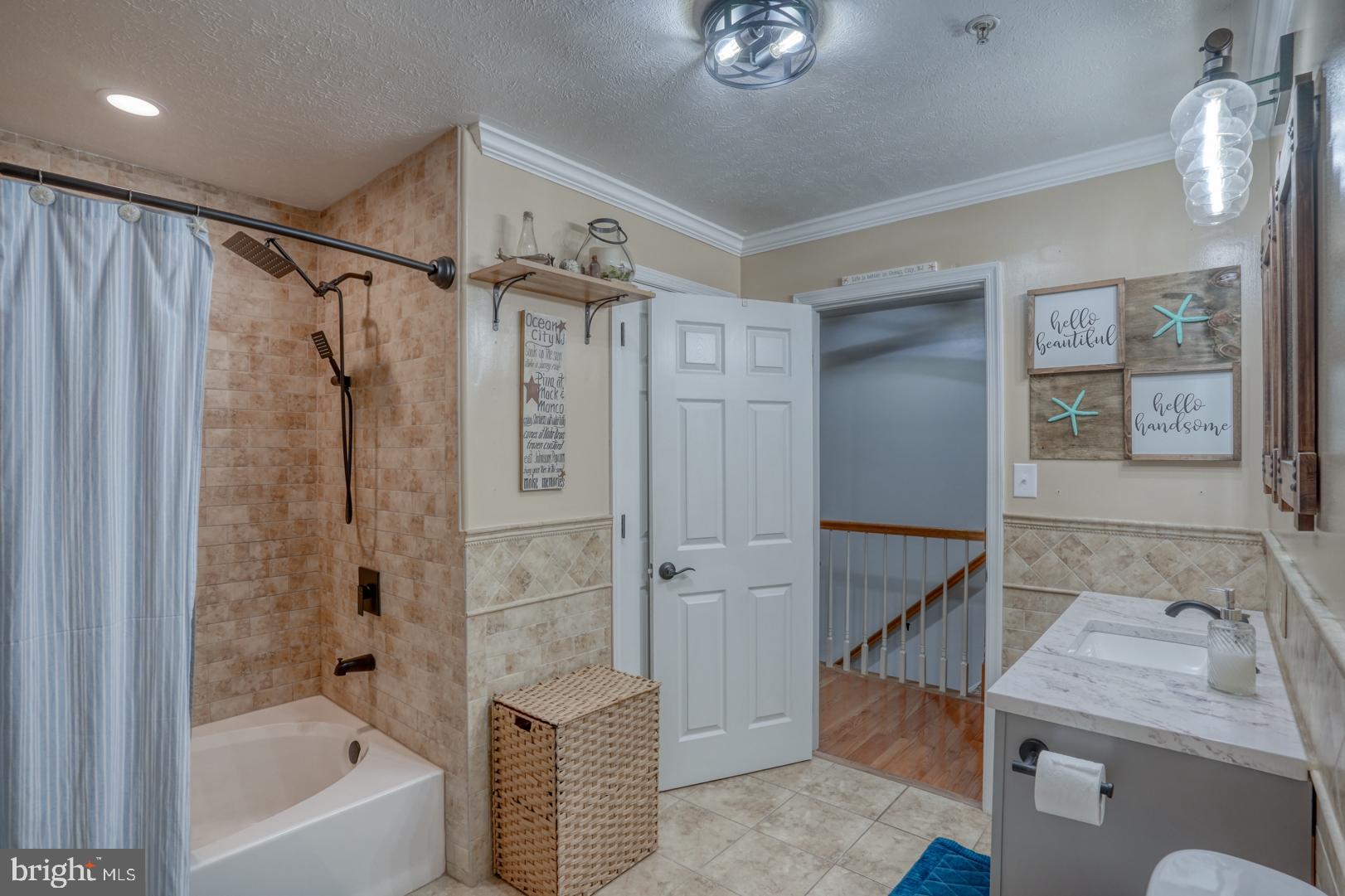 212 Mike Drive Elkton, MD 21921 - Photo 27 of 39 a bathroom with a granite countertop sink mirror bathtub and shower