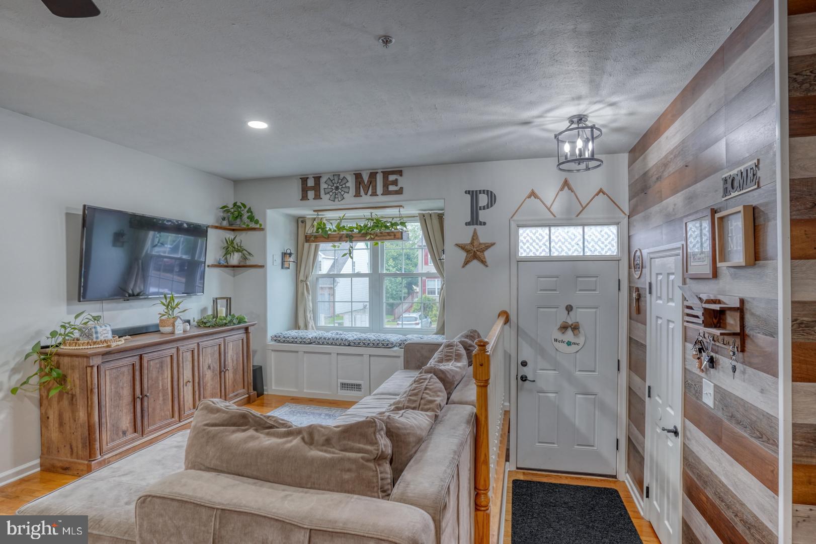 212 Mike Drive Elkton, MD 21921 - Photo 9 of 39 a living room with furniture and a chandelier