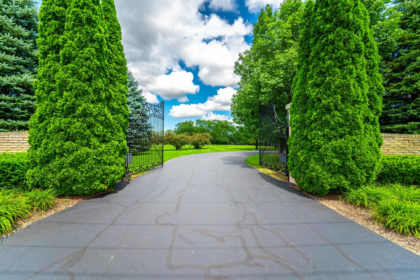 228 East Goodenow Road Beecher, IL 60401 - Photo 2 of 79 a view of a garden with a building in the background