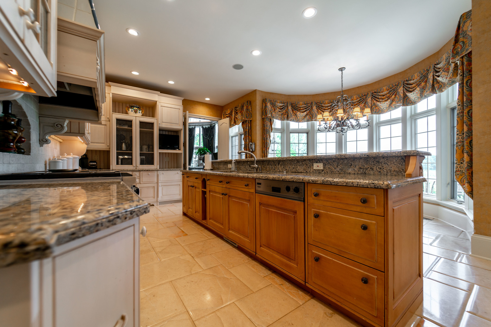 228 East Goodenow Road Beecher, IL 60401 - Photo 22 of 79 a kitchen with granite countertop a sink and a stove