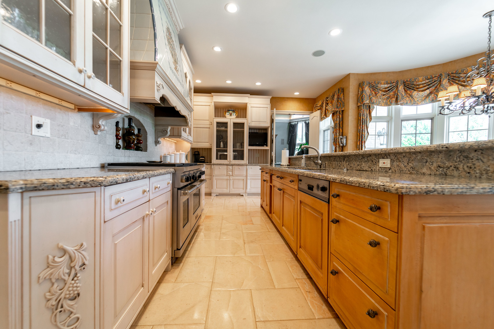 228 East Goodenow Road Beecher, IL 60401 - Photo 23 of 79 a large kitchen with stainless steel appliances granite countertop a large stove top oven and cabinets