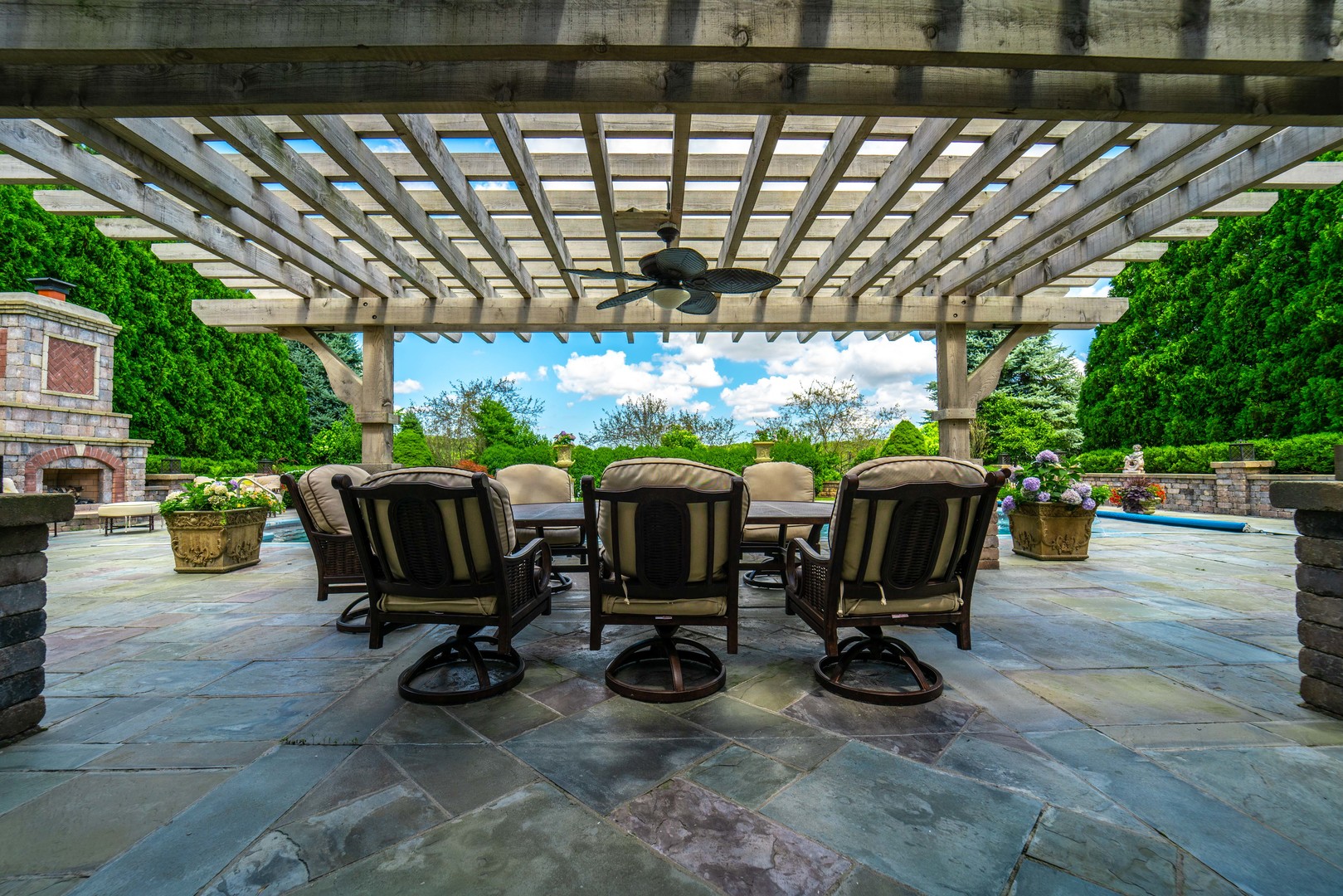 228 East Goodenow Road Beecher, IL 60401 - Photo 53 of 79 a view of a patio with table and chairs under an umbrella with a big yard