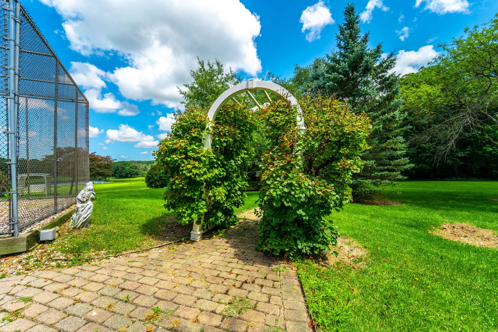 228 East Goodenow Road Beecher, IL 60401 - Photo 70 of 79 a view of a garden with a pathway