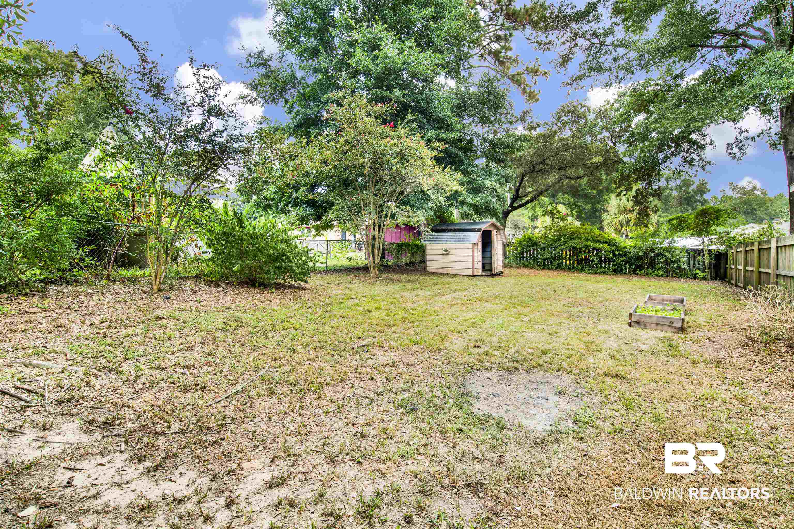 3560 Creekway Road Mobile, AL 36619 - Photo 22 of 24 View of yard with a storage shed