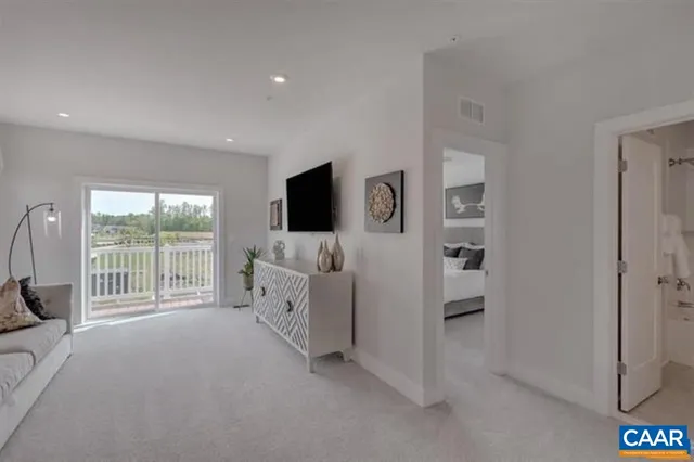 a view of livingroom with furniture and window
