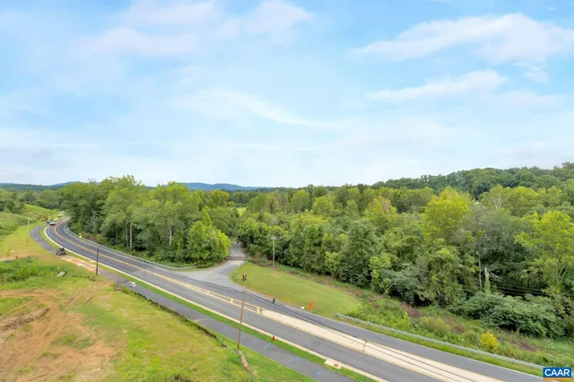 a view of a forest from a balcony
